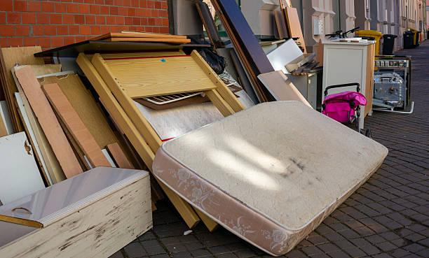Bulky waste apartment clearance recycling standing on the footpath in the city